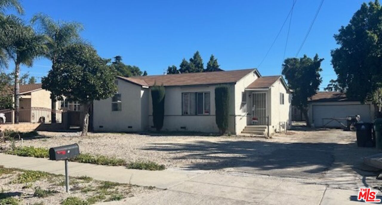 13678 Filmore Street Pacoima, CA 91331 - Photo 6 of 6 a front view of a house with a tree