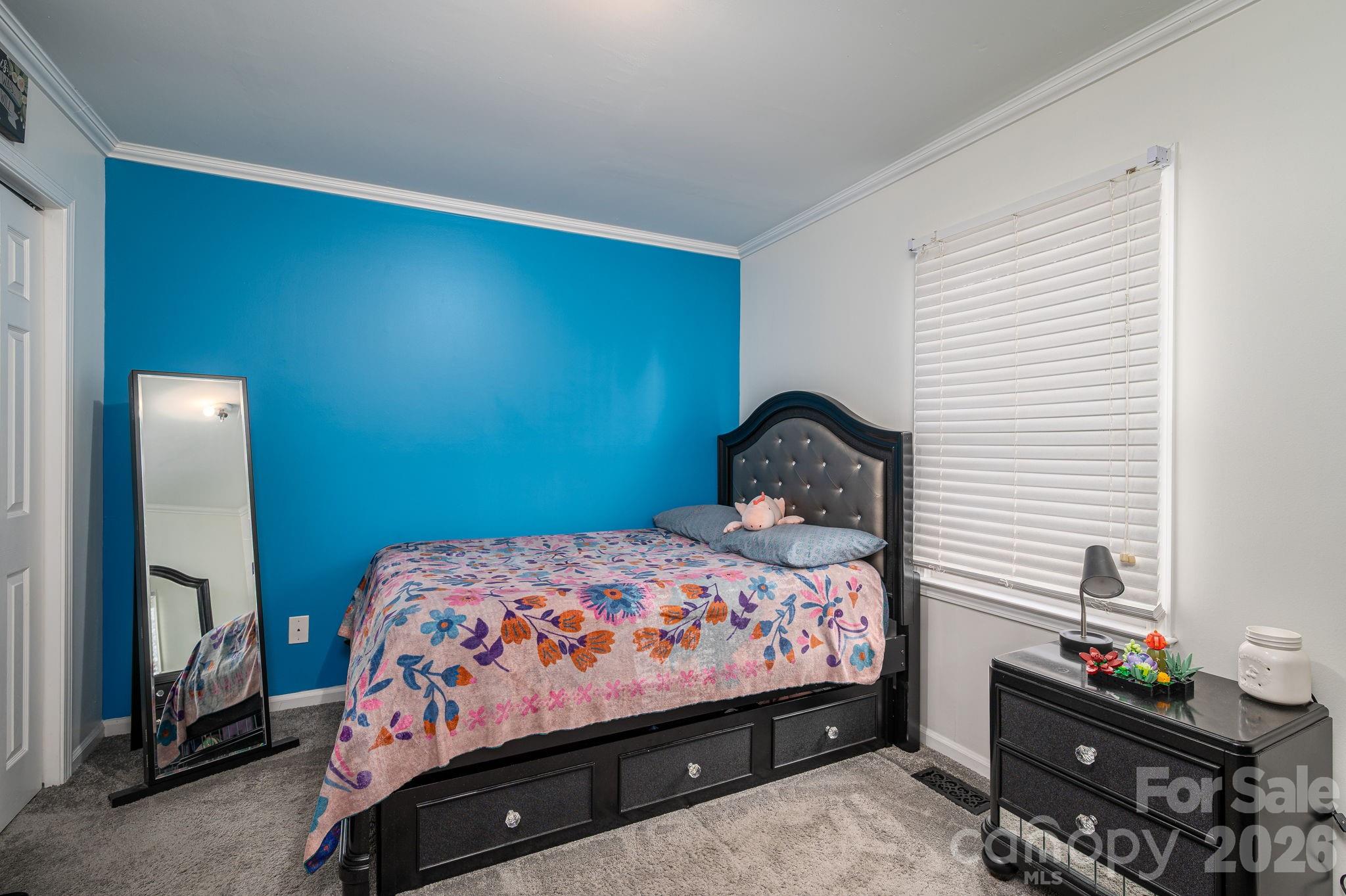 112 Pilots Ridge Drive Bessemer City, NC 28016 - Photo 17 of 36 a bedroom with a bed and a dresser