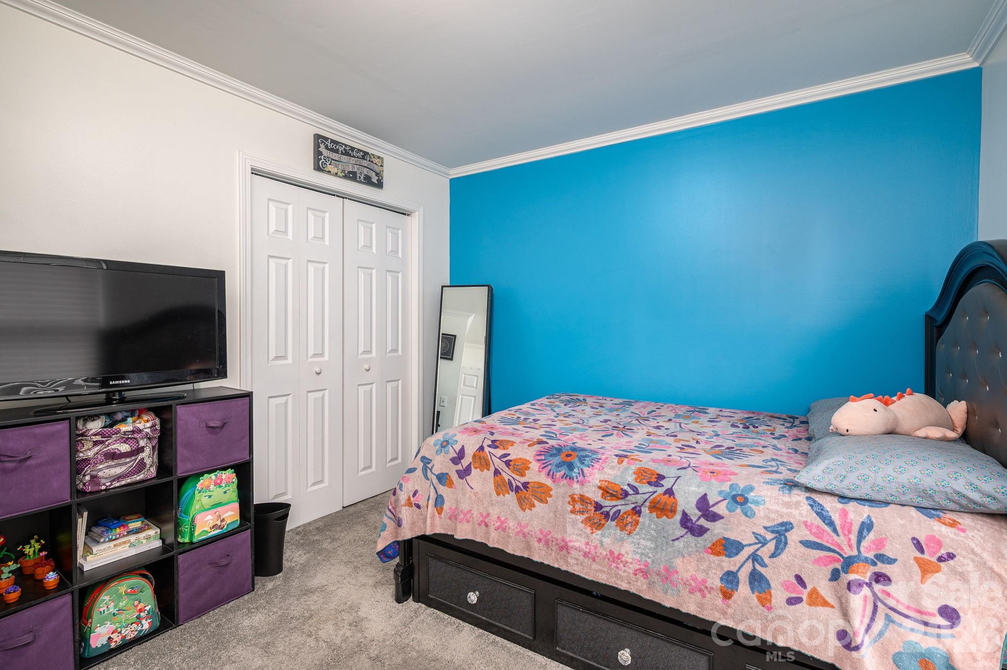 112 Pilots Ridge Drive Bessemer City, NC 28016 - Photo 18 of 36 a bedroom with a bed and a flat screen tv