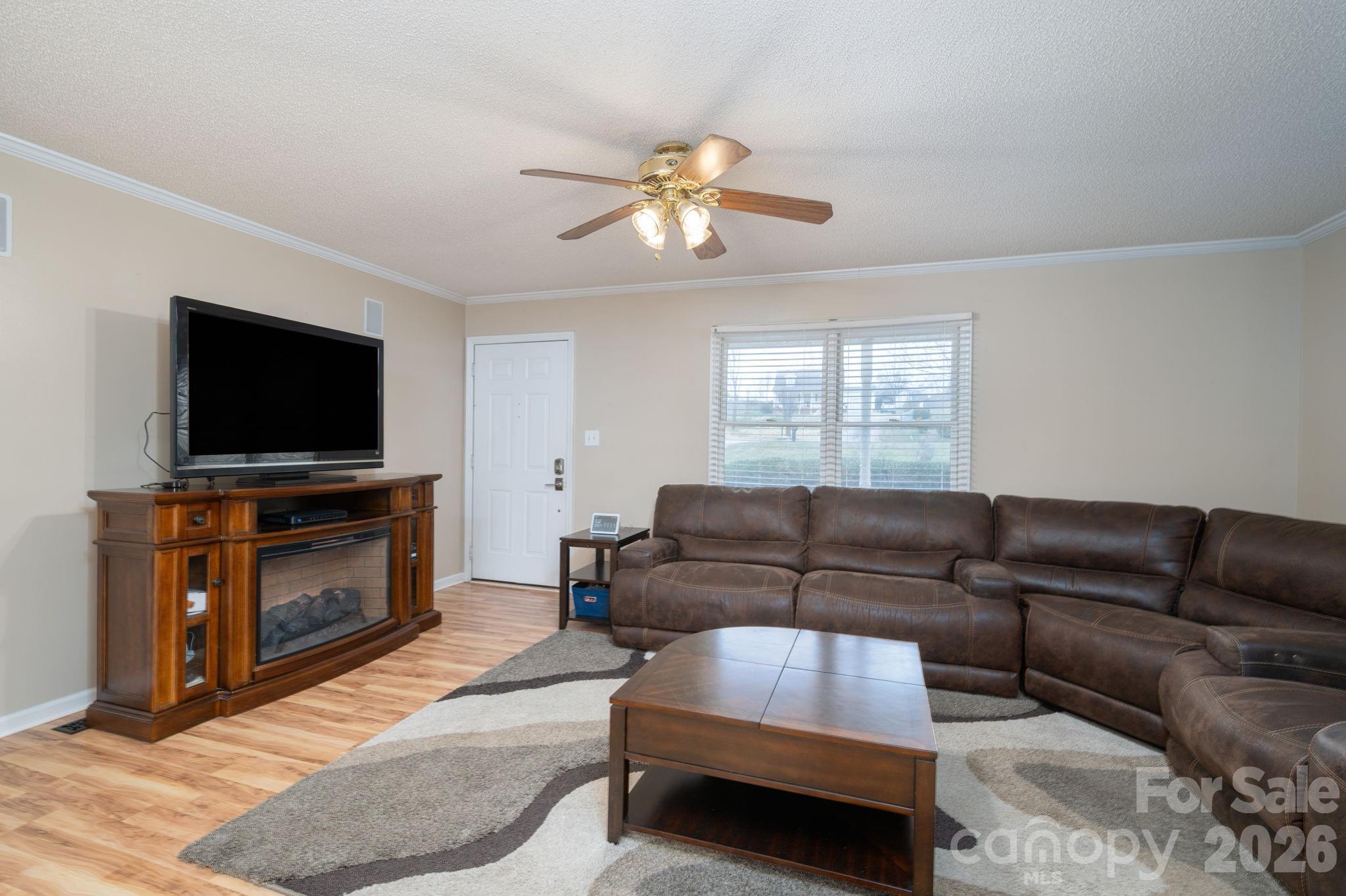 112 Pilots Ridge Drive Bessemer City, NC 28016 - Photo 21 of 36 a living room with furniture and a flat screen tv
