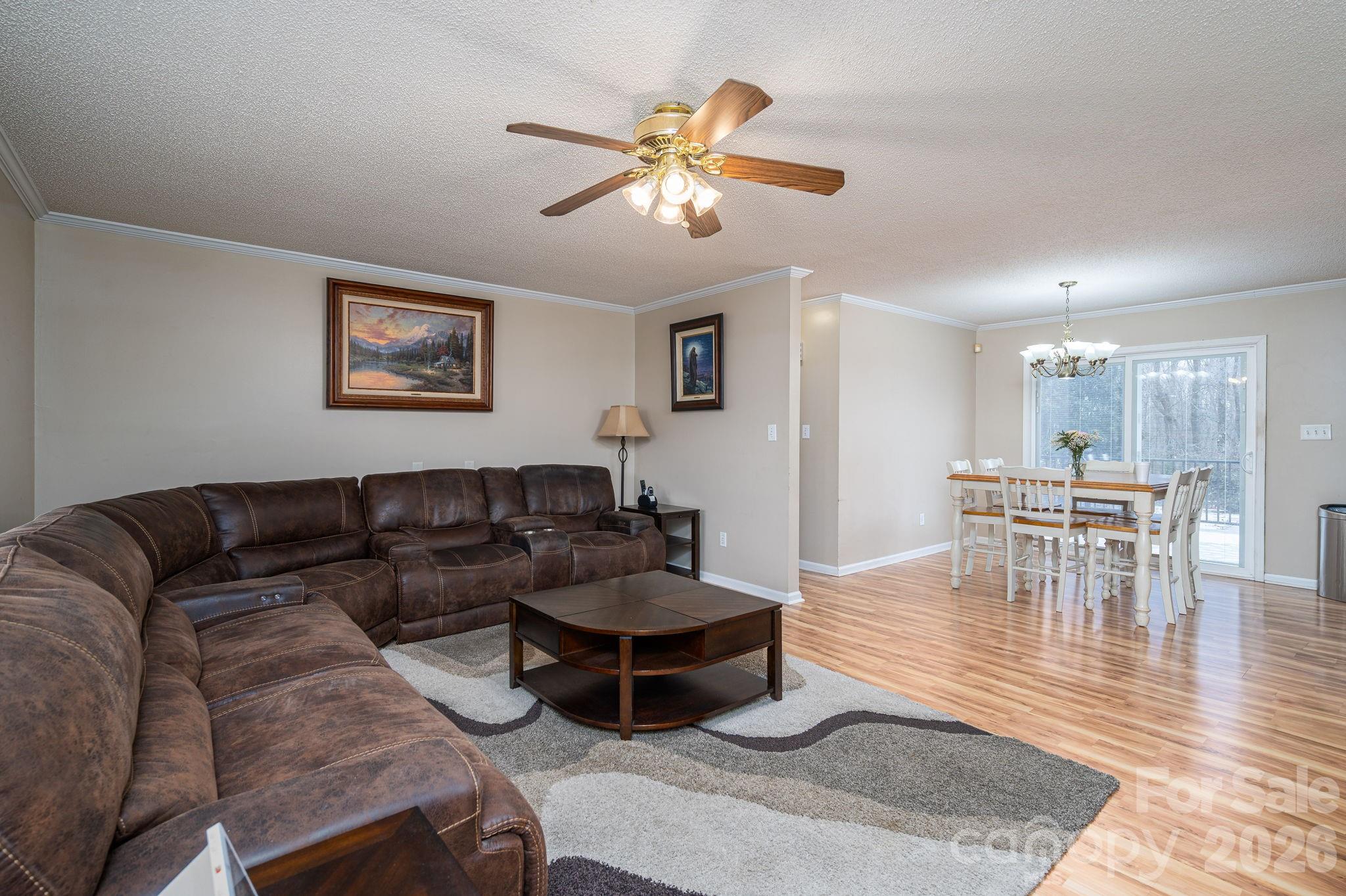 112 Pilots Ridge Drive Bessemer City, NC 28016 - Photo 22 of 36 a living room with furniture and a wooden floor
