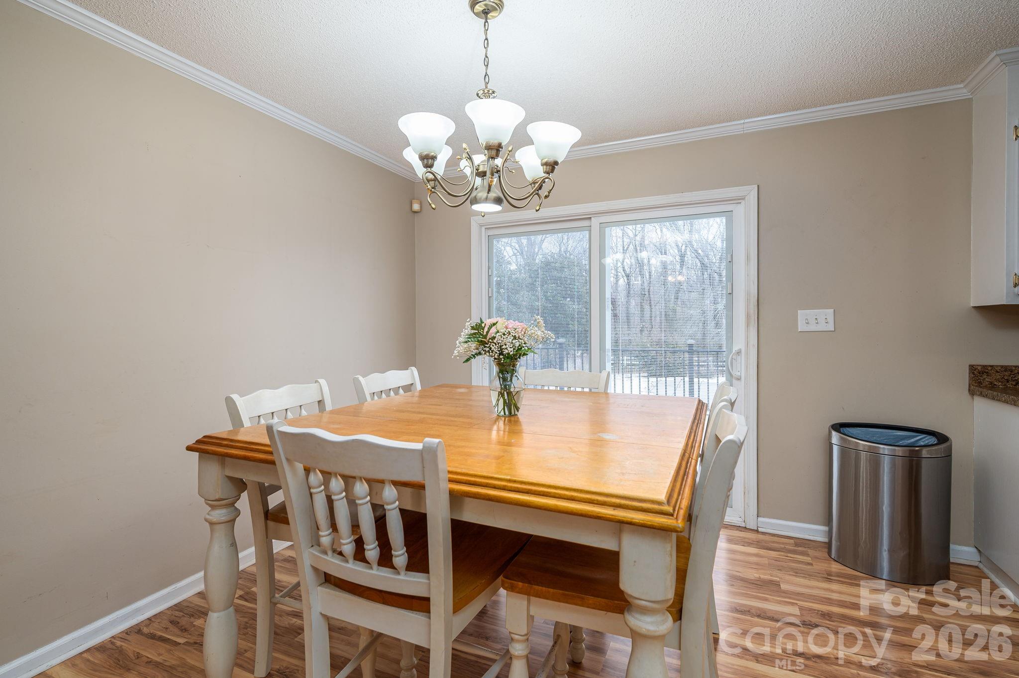 112 Pilots Ridge Drive Bessemer City, NC 28016 - Photo 28 of 36 a view of a dining room with furniture and wooden floor