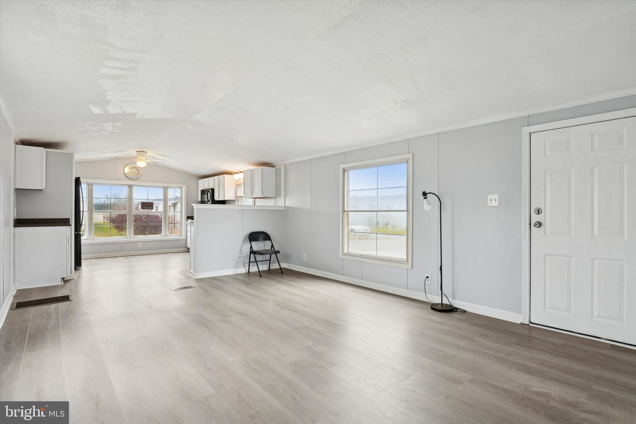 1920 Brian Circle, Unit 650 Bear, DE 19701 - Photo 3 of 25 an empty room with wooden floor and windows