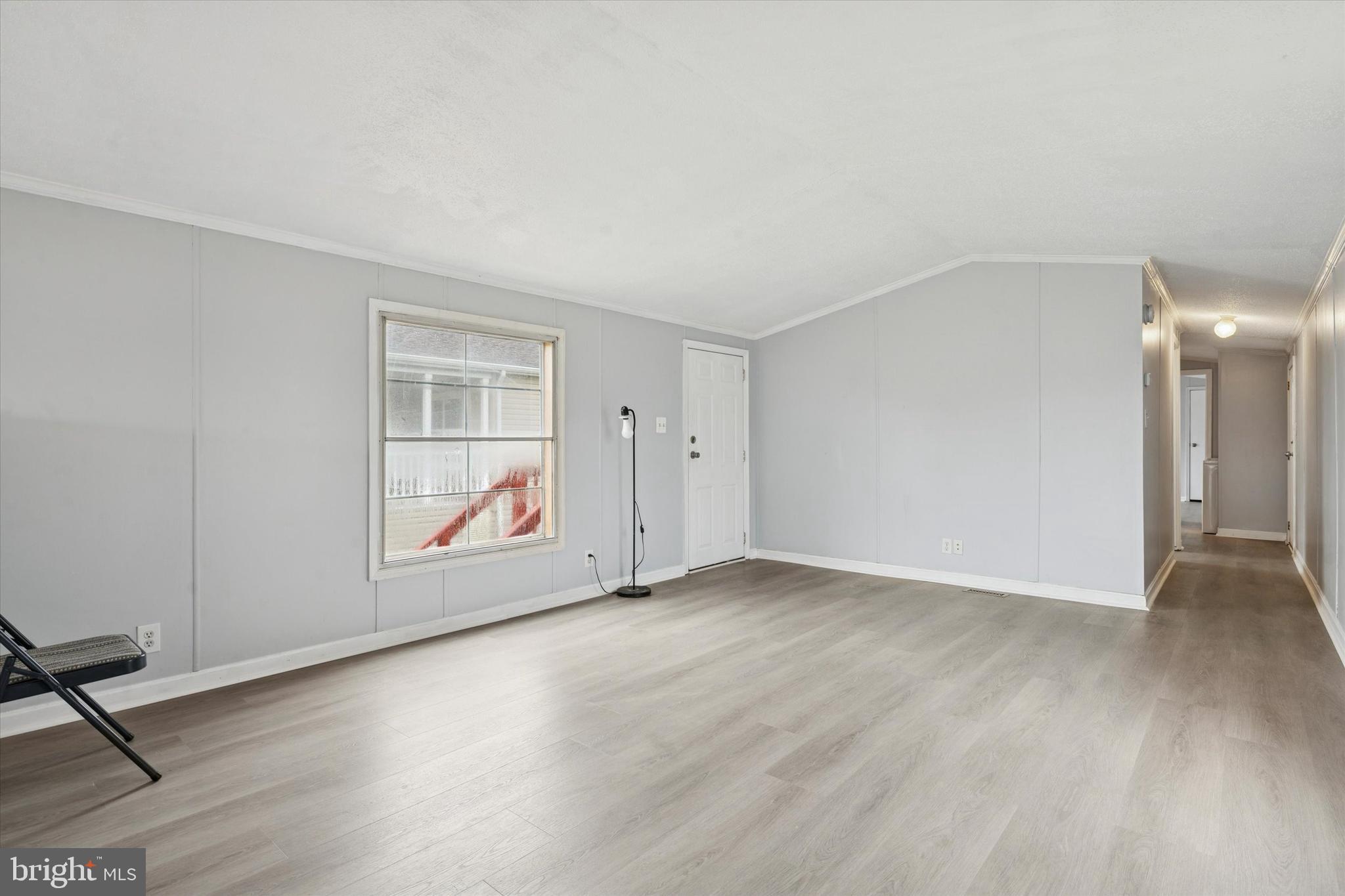 1920 Brian Circle, Unit 650 Bear, DE 19701 - Photo 5 of 25 an empty room with wooden floor and windows