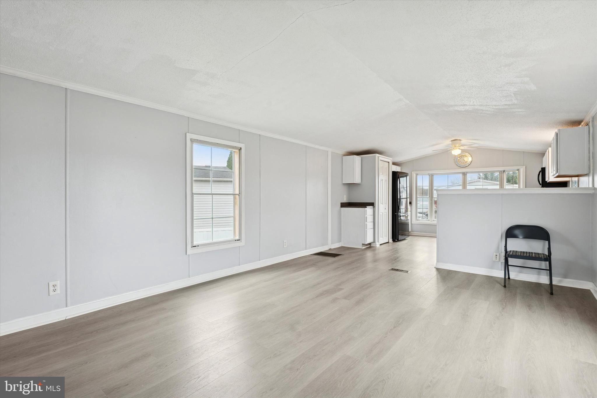 1920 Brian Circle, Unit 650 Bear, DE 19701 - Photo 6 of 25 a view of an empty room with window and wooden floor