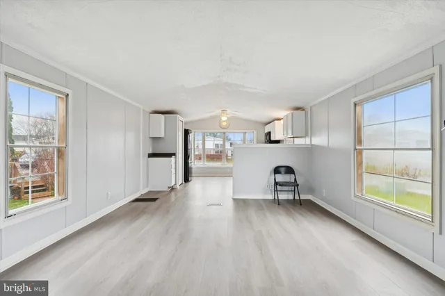 a view of a kitchen with a sink and a window