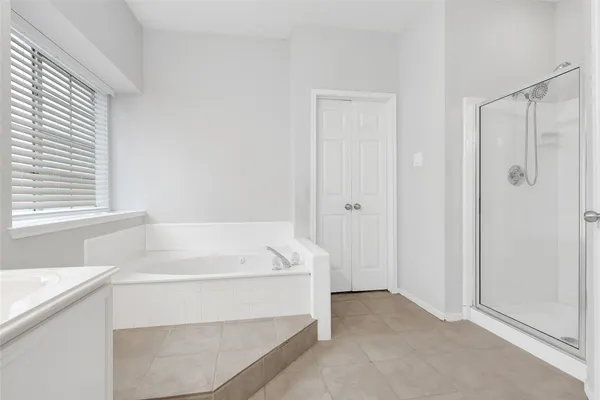 a bathroom with a bathtub and a sink