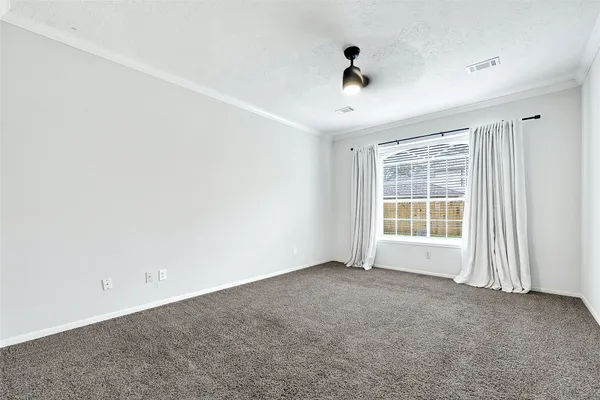 an empty room with a empty space and windows