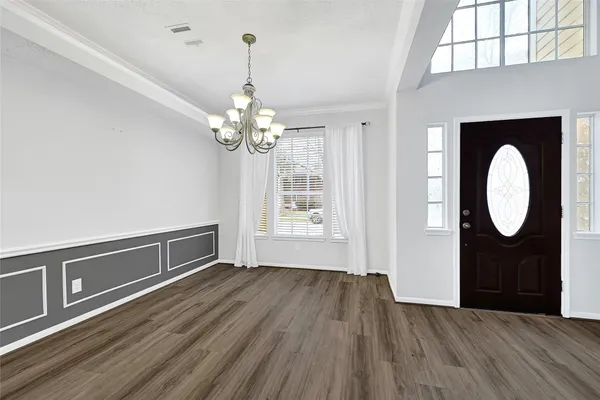 a view of a livingroom with wooden floor