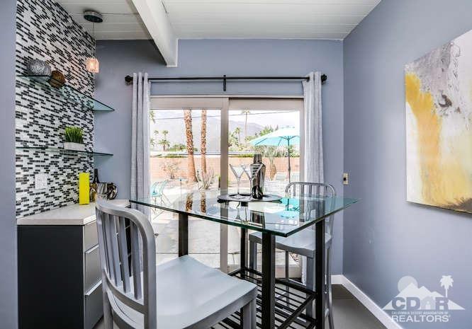 235 North Michelle Road Palm Springs, CA 92262 - Photo 16 of 52 a view of a dining room with furniture a chandelier and a window