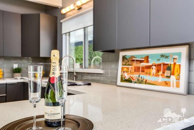 235 North Michelle Road Palm Springs, CA 92262 - Photo 19 of 52 a kitchen with stainless steel appliances kitchen island granite countertop a sink and a window