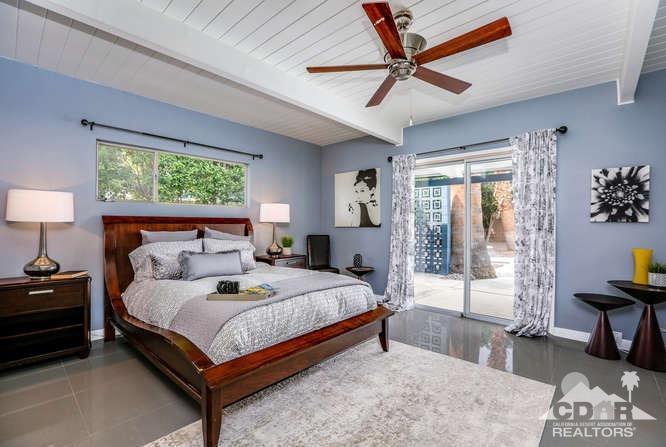 235 North Michelle Road Palm Springs, CA 92262 - Photo 23 of 52 a bedroom with a bed and a table