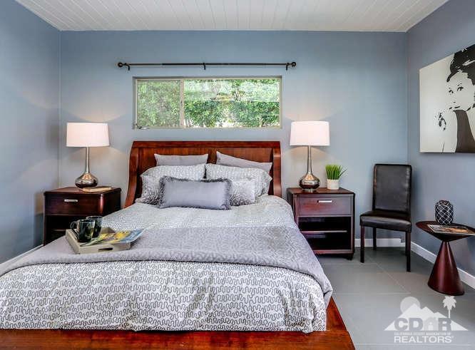 235 North Michelle Road Palm Springs, CA 92262 - Photo 24 of 52 a large bed sitting in a bedroom next to a window with lamp