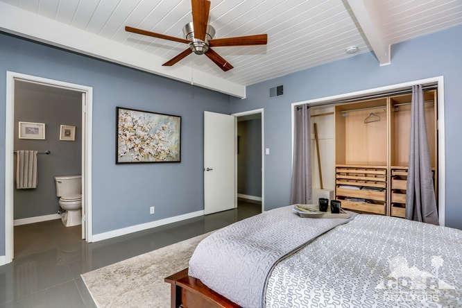 235 North Michelle Road Palm Springs, CA 92262 - Photo 25 of 52 a bedroom with bed and a chandelier