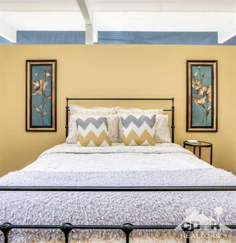 235 North Michelle Road Palm Springs, CA 92262 - Photo 28 of 52 a bedroom with a bed and painting on the wall
