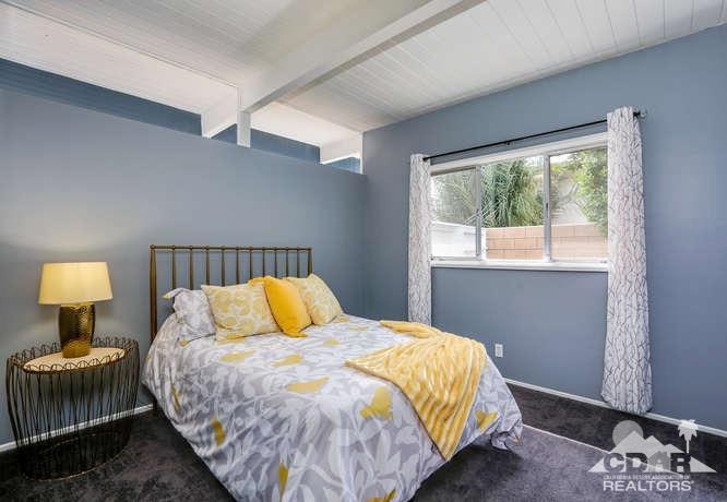 235 North Michelle Road Palm Springs, CA 92262 - Photo 30 of 52 a bedroom with a bed and window