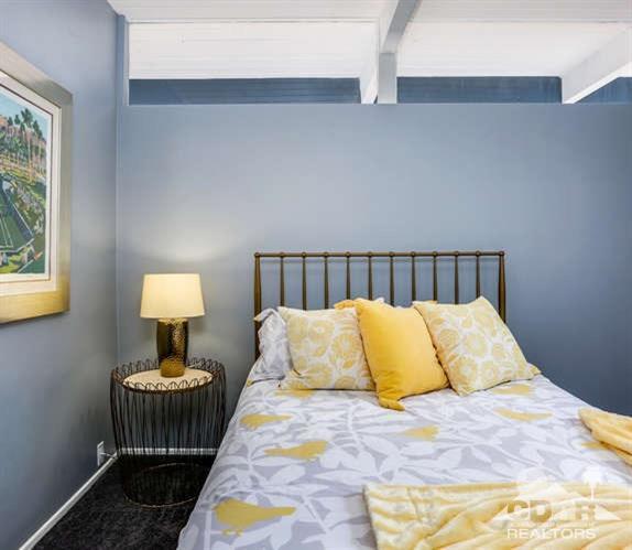 235 North Michelle Road Palm Springs, CA 92262 - Photo 31 of 52 a bedroom with a bed and a lamp