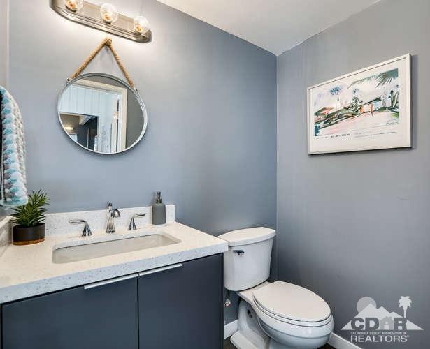 235 North Michelle Road Palm Springs, CA 92262 - Photo 32 of 52 a bathroom with a toilet a sink and mirror