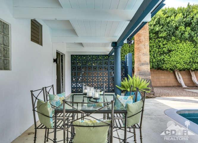 235 North Michelle Road Palm Springs, CA 92262 - Photo 33 of 52 a view of an outdoor dining space with a table and chairs