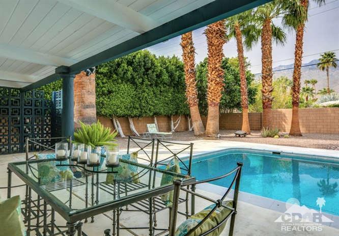 235 North Michelle Road Palm Springs, CA 92262 - Photo 34 of 52 a view of swimming pool with outdoor seating and plants