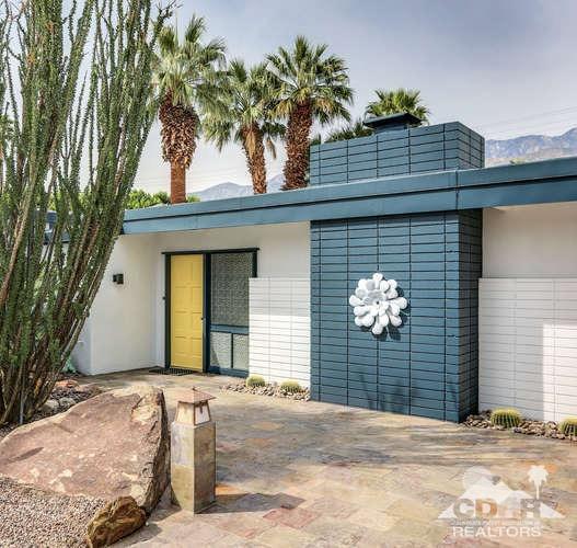 235 North Michelle Road Palm Springs, CA 92262 - Photo 5 of 52 a front view of a house with a yard and garage