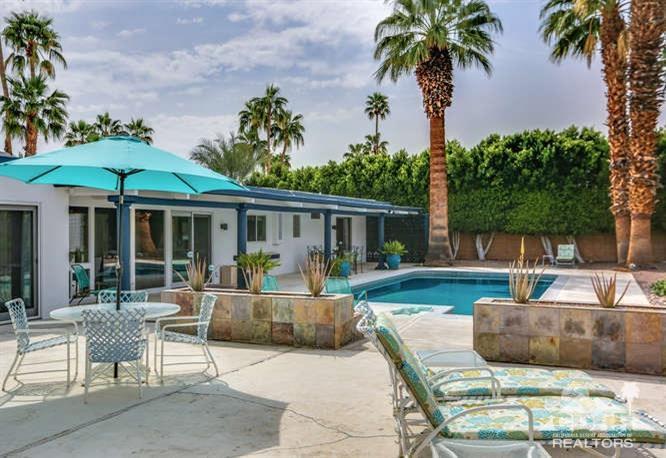 235 North Michelle Road Palm Springs, CA 92262 - Photo 42 of 52 a view of a house with backyard sitting area and swimming pool
