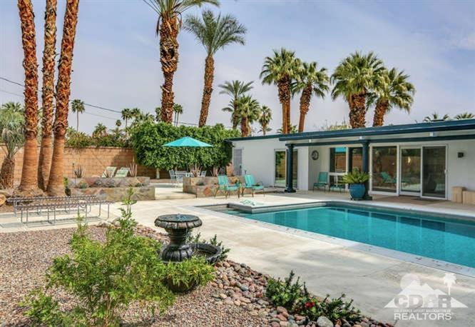 235 North Michelle Road Palm Springs, CA 92262 - Photo 44 of 52 front view of a house with swimming pool and a garden