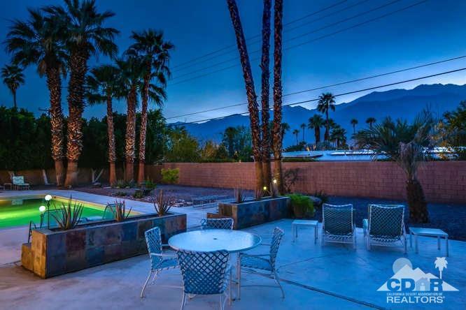 235 North Michelle Road Palm Springs, CA 92262 - Photo 50 of 52 a backyard of a house with dining table and chairs