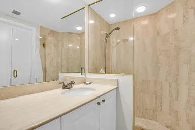 a bathroom with a sink double vanity and a mirror