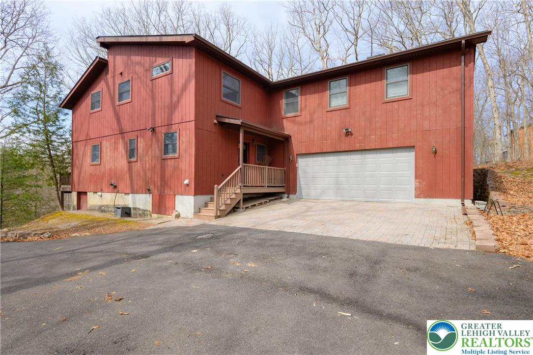6159 Decker Road Bushkill, PA 18324 - Photo 11 of 49 a front view of a house with a yard
