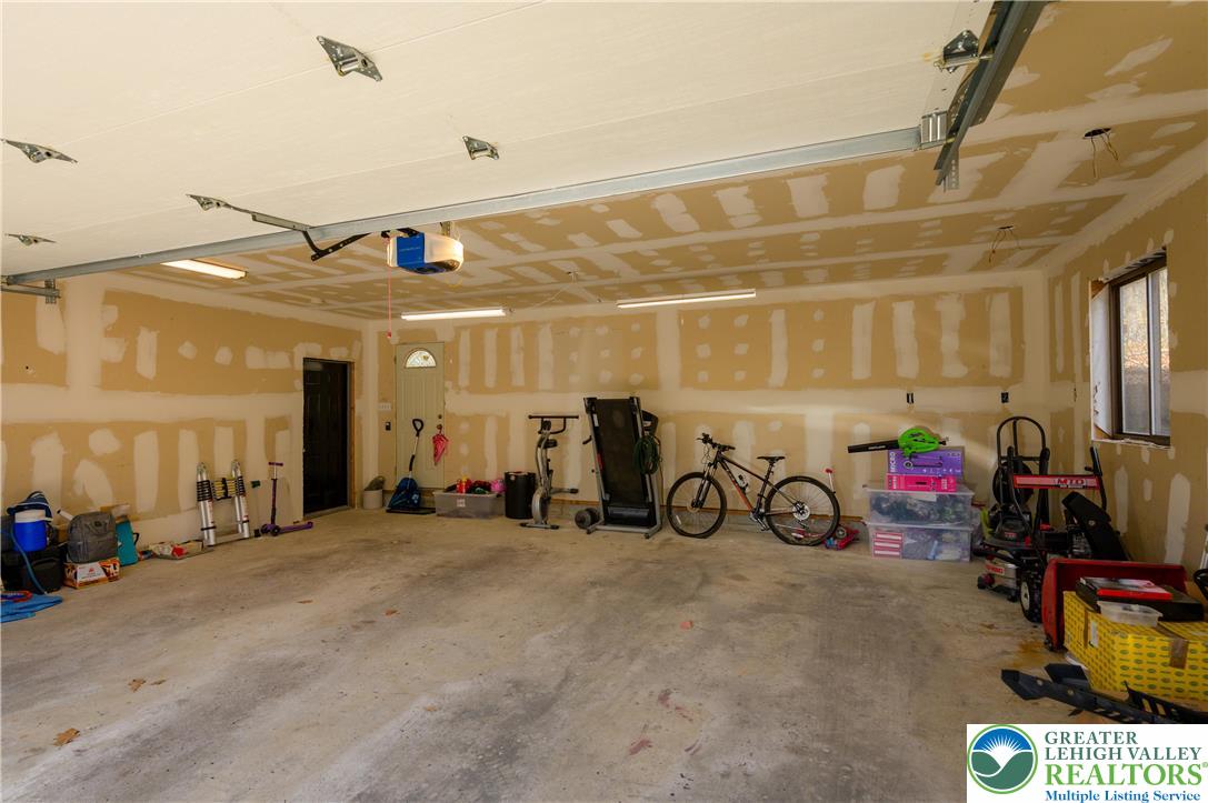 6159 Decker Road Bushkill, PA 18324 - Photo 13 of 49 a view of a garage with cars