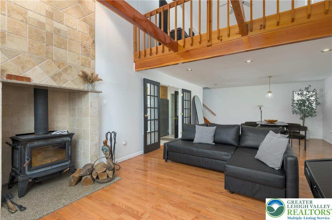 6159 Decker Road Bushkill, PA 18324 - Photo 20 of 49 a living room with furniture a flat screen tv and a fireplace