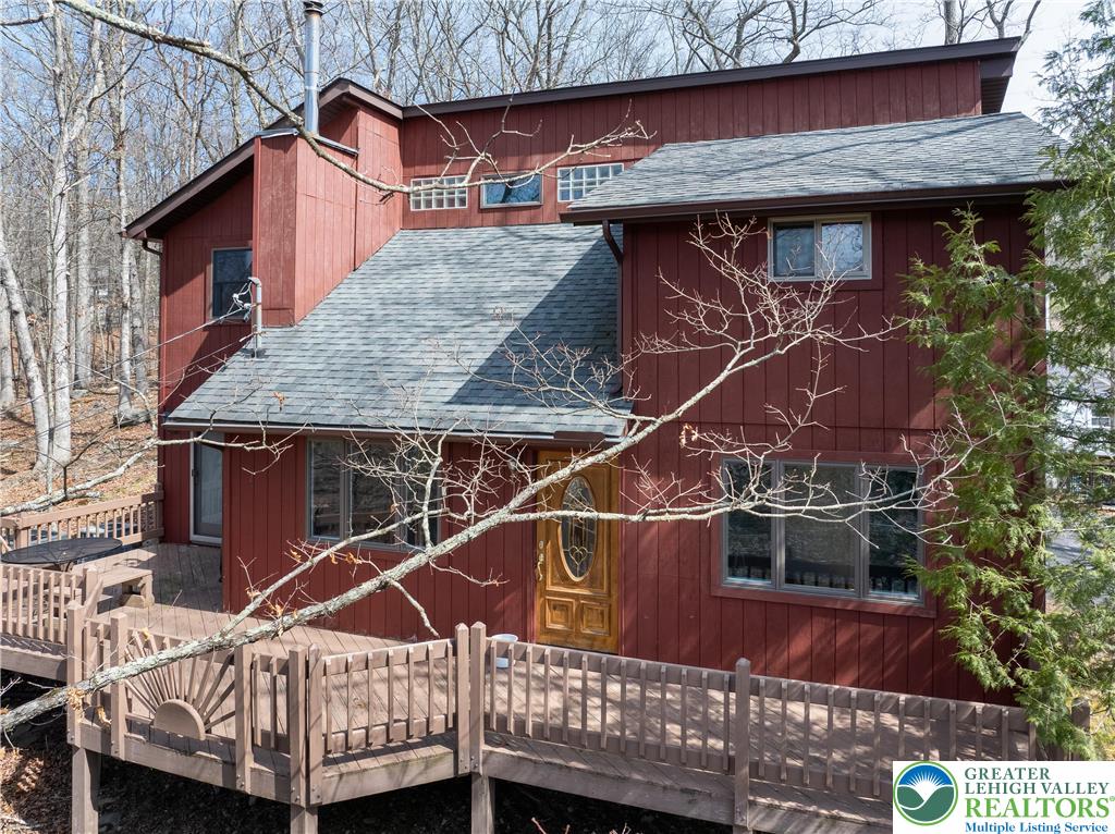 6159 Decker Road Bushkill, PA 18324 - Photo 2 of 49 a view of a house with a roof deck