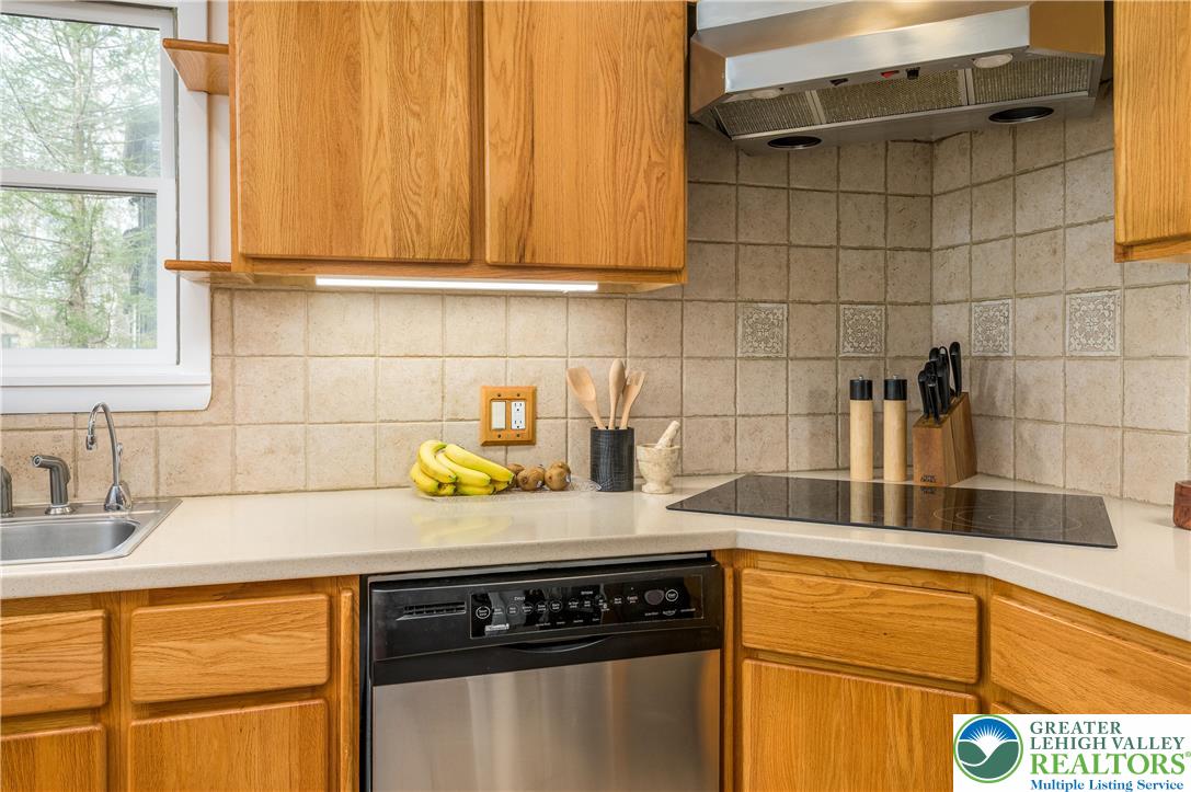 6159 Decker Road Bushkill, PA 18324 - Photo 29 of 49 a kitchen with a sink a stove cabinets and a window