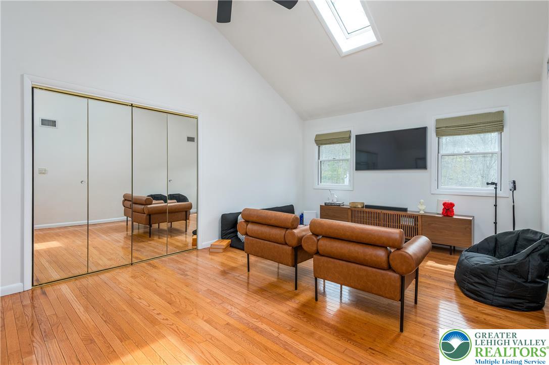 6159 Decker Road Bushkill, PA 18324 - Photo 33 of 49 a living room with furniture a flat screen tv and a window