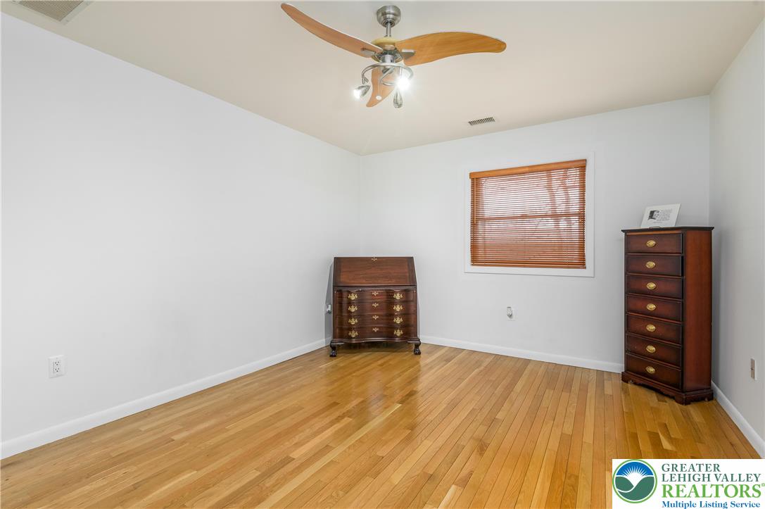 6159 Decker Road Bushkill, PA 18324 - Photo 39 of 49 an empty room with wooden floor closet and windows