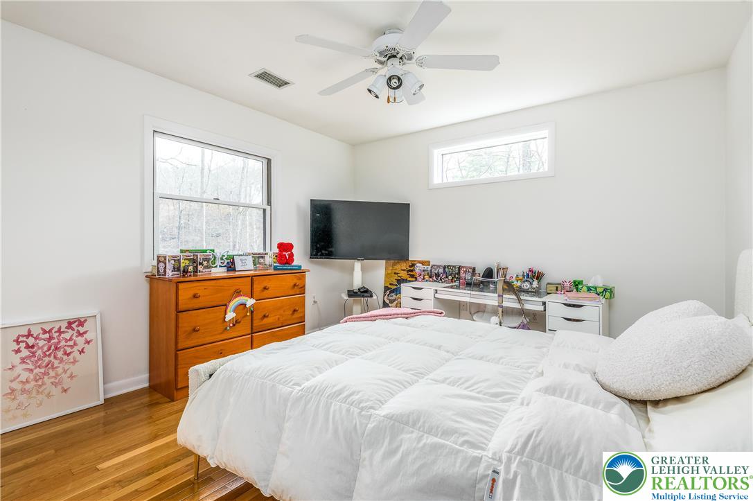 6159 Decker Road Bushkill, PA 18324 - Photo 41 of 49 a bedroom with a bed and a flat screen tv