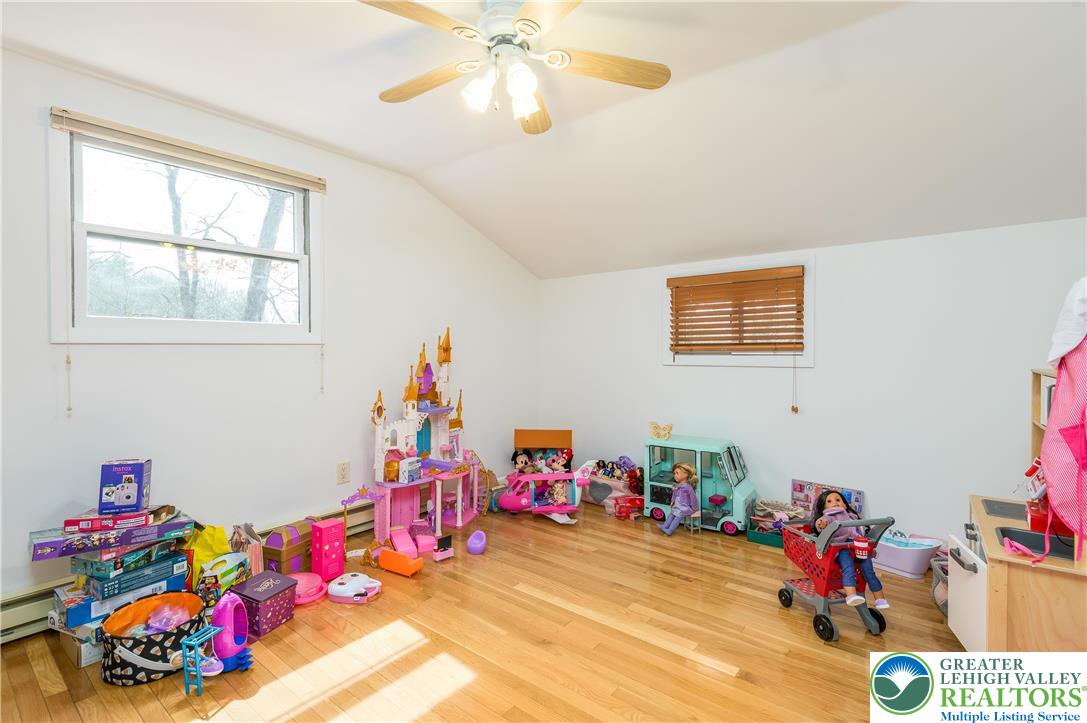 6159 Decker Road Bushkill, PA 18324 - Photo 43 of 49 a play room with toys and a chandelier