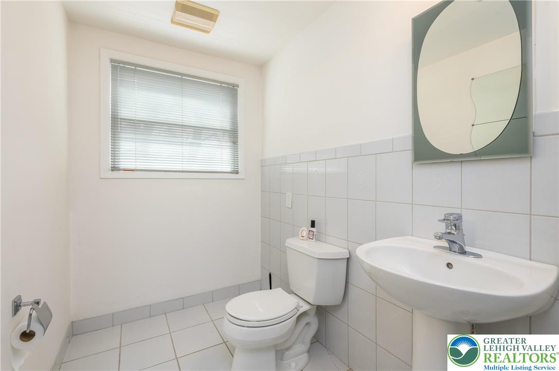 6159 Decker Road Bushkill, PA 18324 - Photo 45 of 49 a bathroom with a sink mirror and toilet