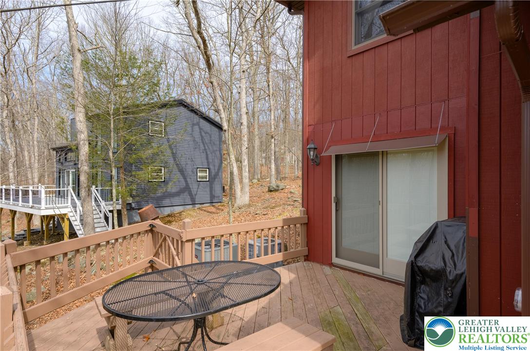6159 Decker Road Bushkill, PA 18324 - Photo 7 of 49 a balcony with table and chairs