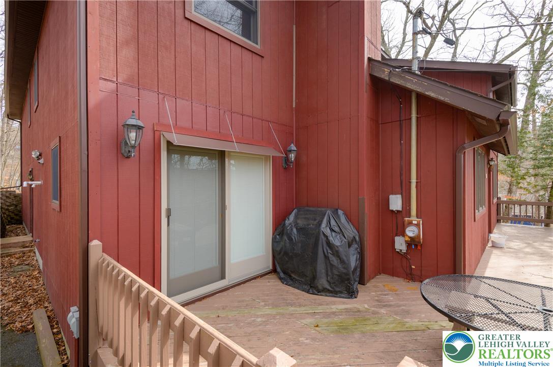 6159 Decker Road Bushkill, PA 18324 - Photo 8 of 49 a view of a wooden door and a wooden fence