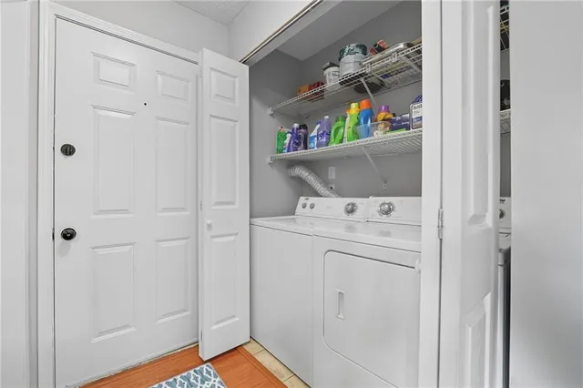 a kitchen with stainless steel appliances granite countertop a sink and a white cabinets
