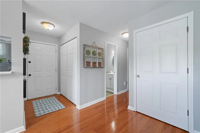 a kitchen with stainless steel appliances granite countertop a refrigerator and microwave
