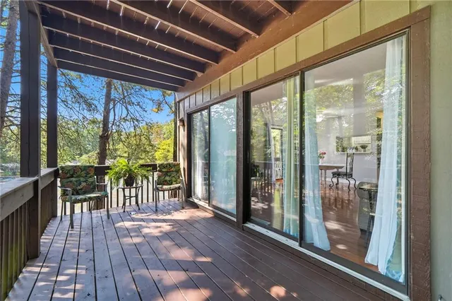 a view of a two chairs in the balcony