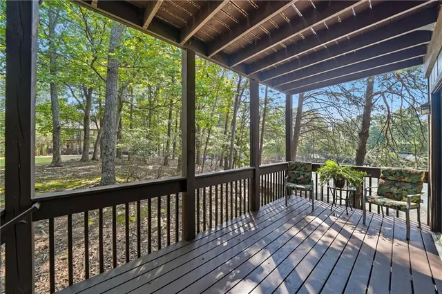 a view of a field with trees in the background
