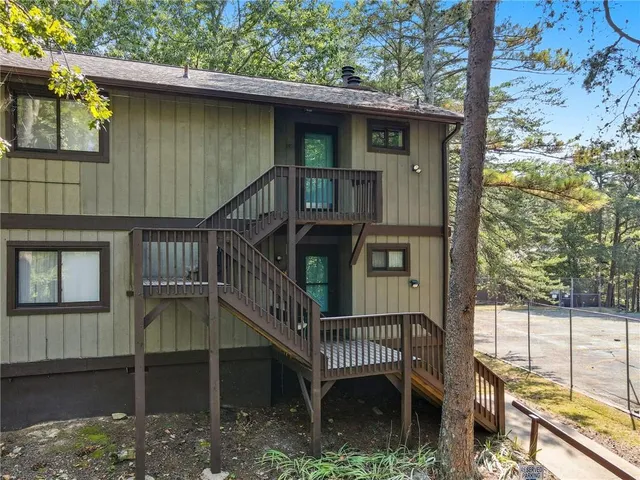 a view of a house with wooden stairs