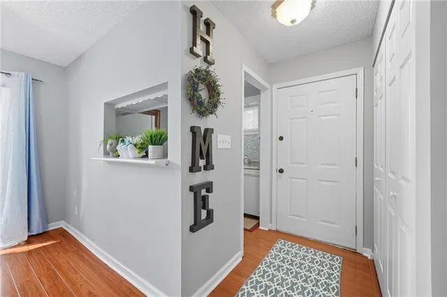 a view of room with window and wooden floor