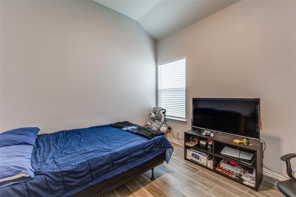 8730 Dunlap Street Dallas, TX 75217 - Photo 14 of 15 a living room with furniture and a flat screen tv