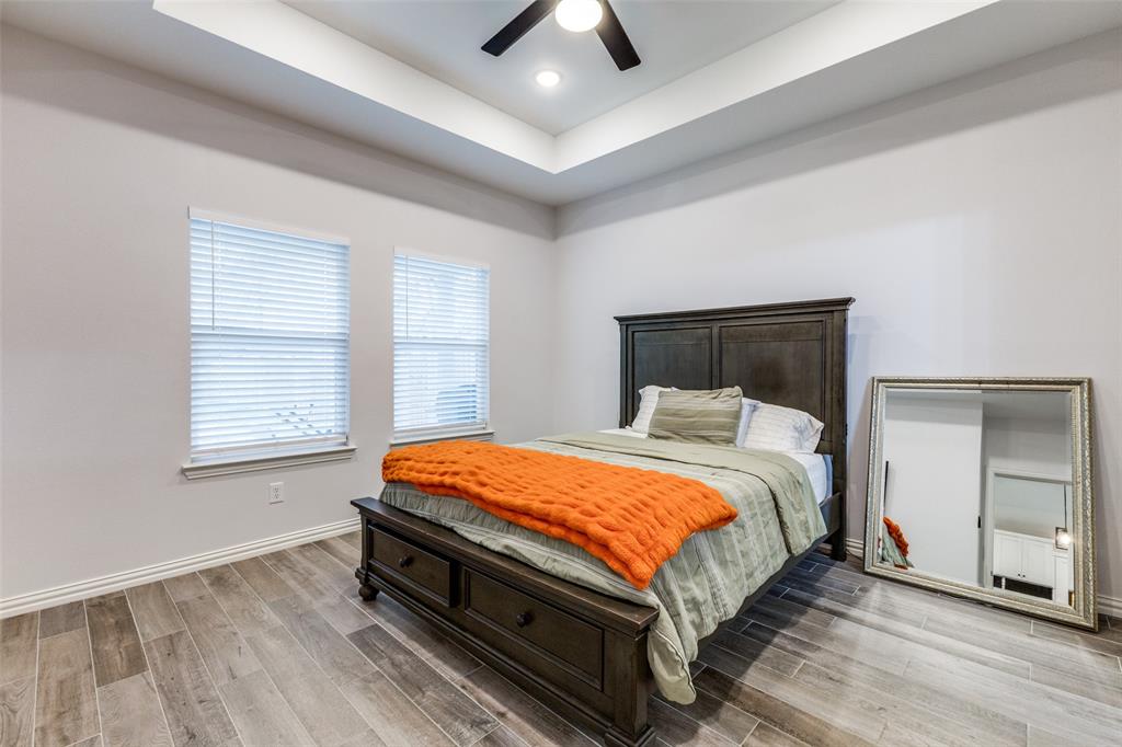 8730 Dunlap Street Dallas, TX 75217 - Photo 8 of 15 a bed sitting in a bedroom next to a window