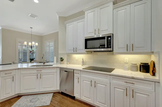 a living room with furniture and a stairs
